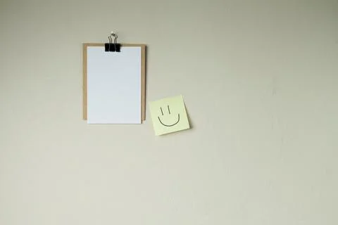 Clipboard with post it notes and smile on the wall. smile concept. clipboard  Stock Photos