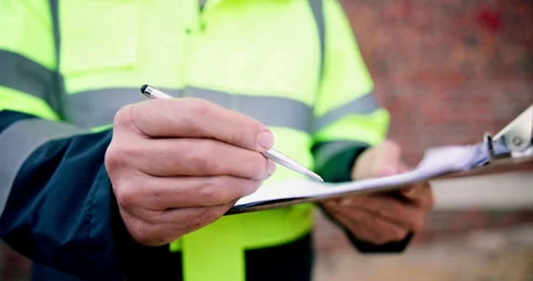 Clipboard, writing and man on construction site for task brief, inspection or Stock Footage 337038582