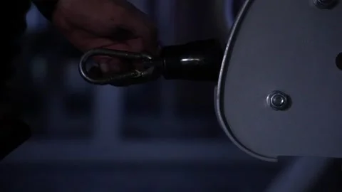 Clipping the handle on the weighing machine to start work out Stock Footage 247284438