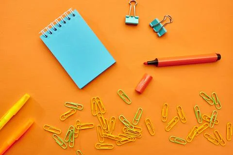 Clips, notepad and marker closeup, stationery Stock Photos