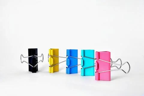 Clips for paper standing vertically on a white background Foto stock