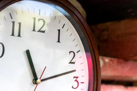 A clock with 11 and 11 on it. Obsolete Round wall clock. time concept Stock Photos
