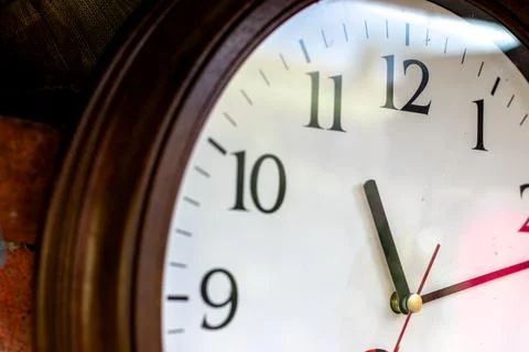 A clock with 11 and 11 on it. Obsolete Round wall clock. time concept Stock Photos