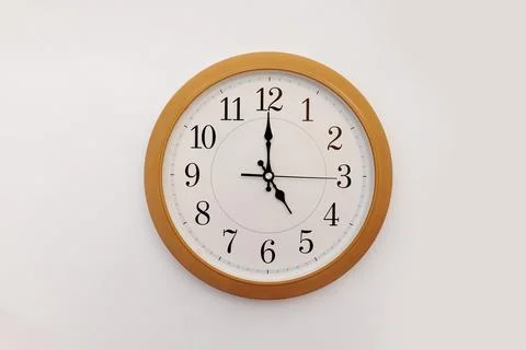 Clock 11.55 on a white background, space for text Photos