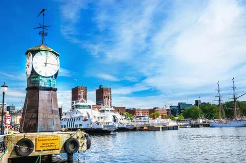Clock on Aker Brygge dock, modern Oslo in Norway Stock Photos