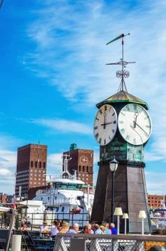 Clock on Aker Brygge Dock, modern part of Oslo Stock Photos