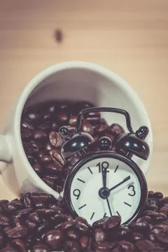 Clock Alarm on Coffee beans Stock Photos