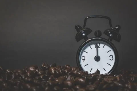 Clock  Alarm on Coffee beans Stock Photos