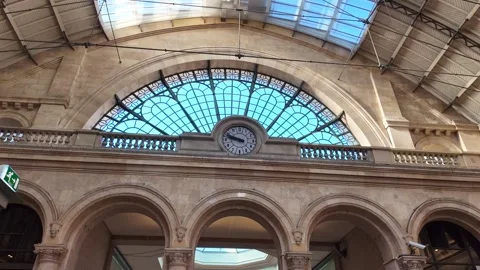 Clock and arched window inside Gare de l'Est train station in Paris, France Stock Footage 336900297