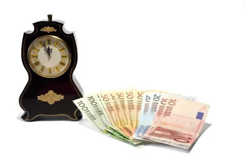 A clock and banknotes Stock Photos