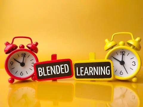 Clock and colored board with text BLENDED LEARNING Stock Photos