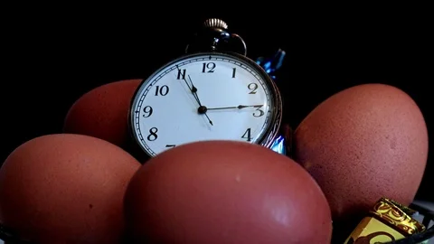 Clock and Easter eggs Stock Footage 125557104