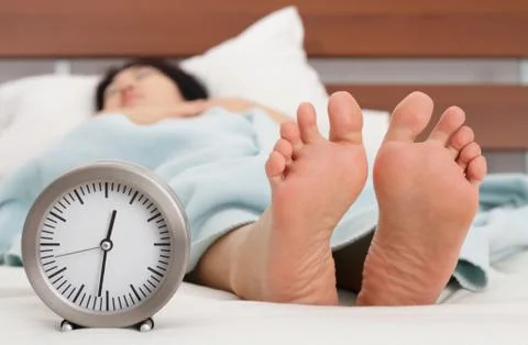 Clock and feet Stock Photos