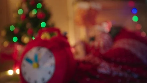 Clock and little boy waiting for gifts on New Years night Stock Footage 73030593