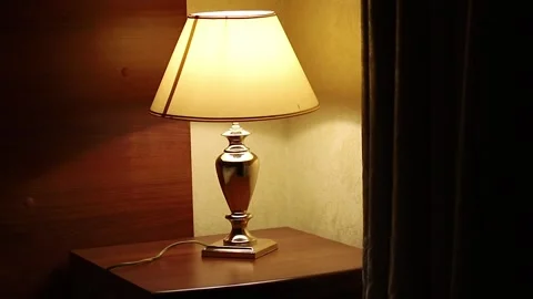 Clock And Night Light On Bedside Table, Hand Take The Clock Stock Footage 312289326