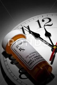 Clock and Pill Bottle Stock Photos