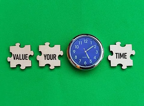 Clock and puzzle with value your time written on it, wise use of time Stock Photos