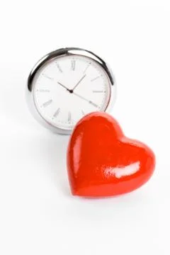 Clock and Red Heart Stock Photos