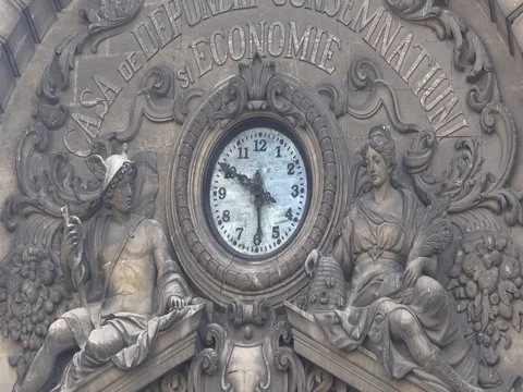 Clock And Statues On Cec Bank Building In Bucharest zoom out stock footage Vídeos de archivo 70960528