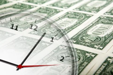 Clock on the background of banknotes dollars Stock Photos