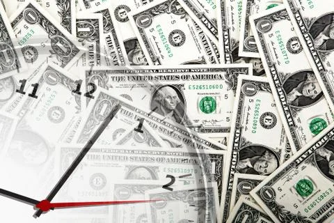 Clock on the background of banknotes dollars Stock Photos