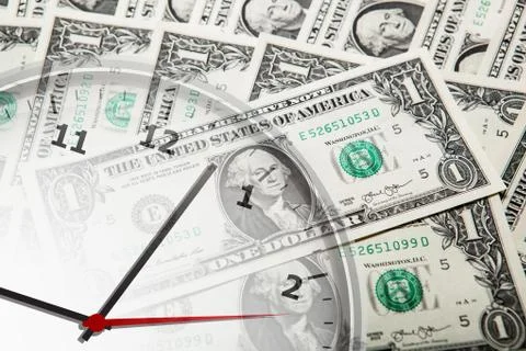 Clock on the background of banknotes dollars Stock Photos