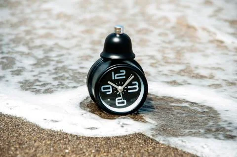 Clock on the beach Stock Photos