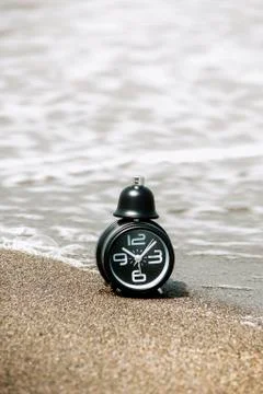 Clock on the beach Stock Photos