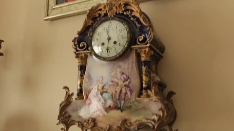 Clock beneath painting Stock Footage 77052290
