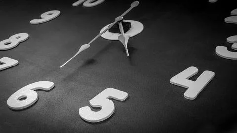 Clock on the black wall Stock Photos