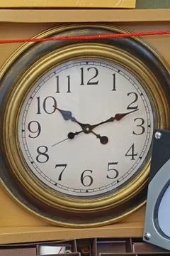 Clock in box Stock Photos