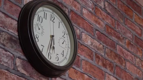 Clock on a brick wall 4K Stock Footage 168880561
