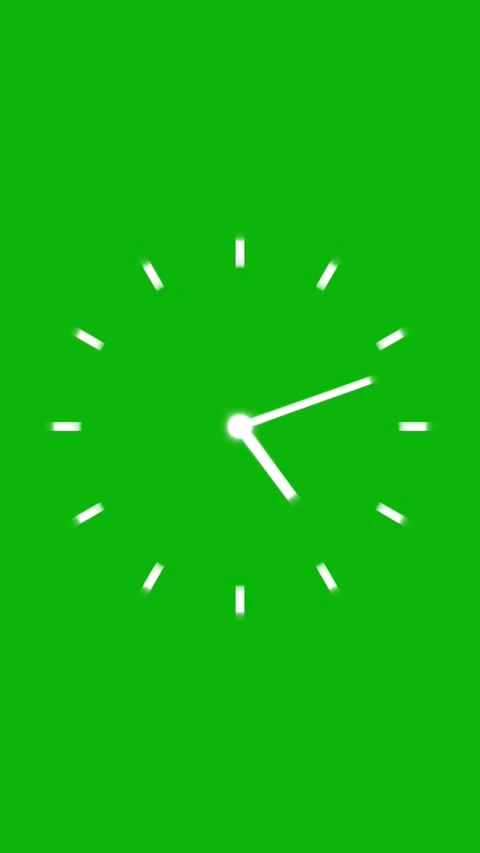 A clock with a bright white face and hands ticks through several hours on a.. Stock Footage 331811614