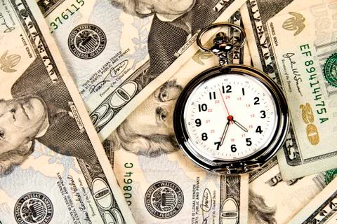 Clock on cash Stock Photos