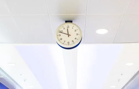 Clock on ceiling at airport Stock Photos