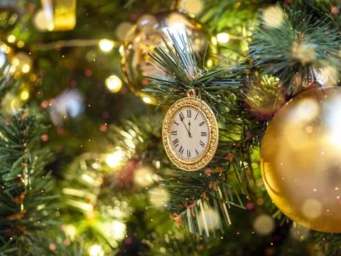 The clock on the Christmas tree. A symbol of the approaching New Year. Stock Photos