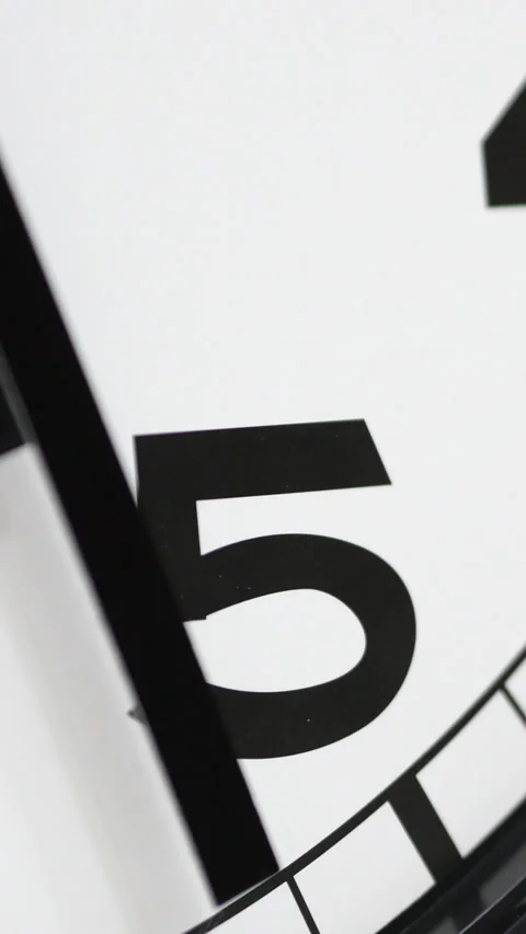 Clock Close Up Showing Black Number Five. Vertical. Video stock 296685497