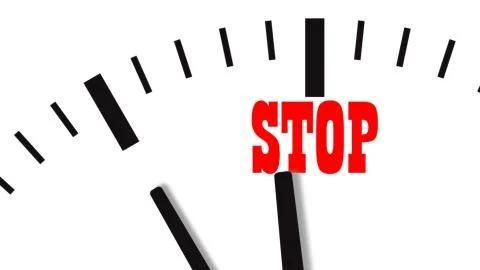 Clock countdown to word STOP Stock Illustration