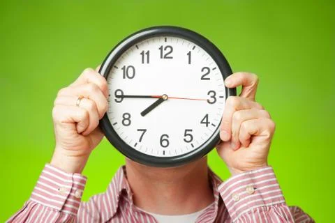 Clock covering face Stock Photos