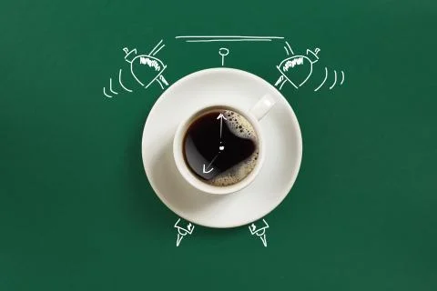 Clock. Cup of fresh espresso with clock sign on green background Stock Photos