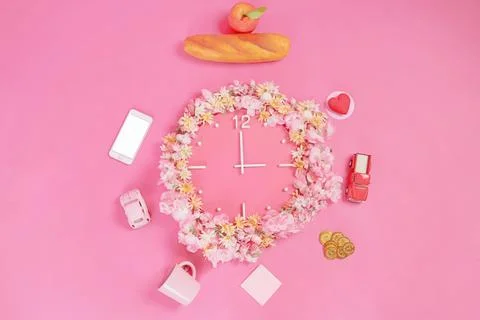 Clock decorated with flowers Stock Photos