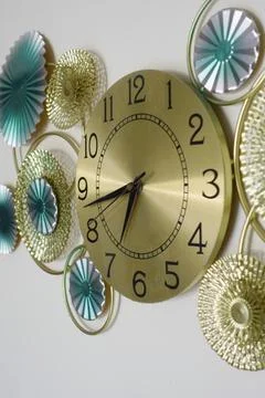 Clock design with colorful decorations on a wall Stock Photos