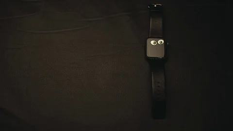 Clock device dark leather background Stock Footage 122310368