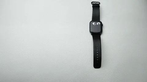 Clock device white leather background hd footage Stock Footage 122309759