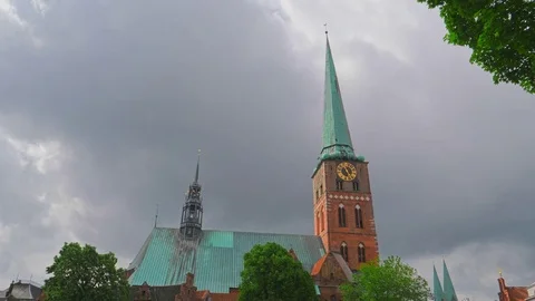 Clock on the facade of Lubeck Dom cathedral church, Germany Stockbeeldmateriaal 81219682