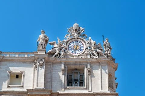 Clock on facade of Saint Peter basilica. Vatican, Italy Stock Photos