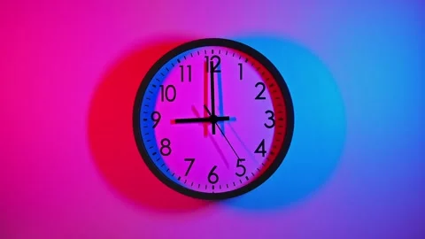 Clock face with blue and red colors. Clock face on colorful background Stock Footage 295438535