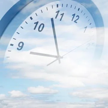 Clock face in blue sky Stock Photos