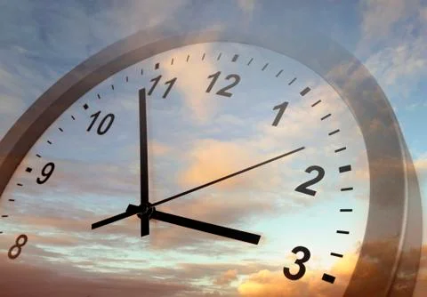 Clock face in bright sky Stock Photos