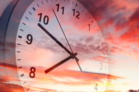 Clock face in bright sky Stock Photos
